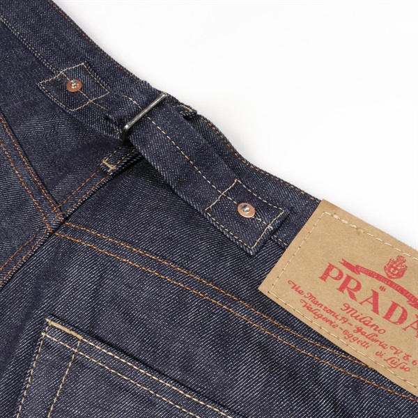 プラダ(PRADA)プラダ セルビッジ トライアングルロゴ デニムパンツ